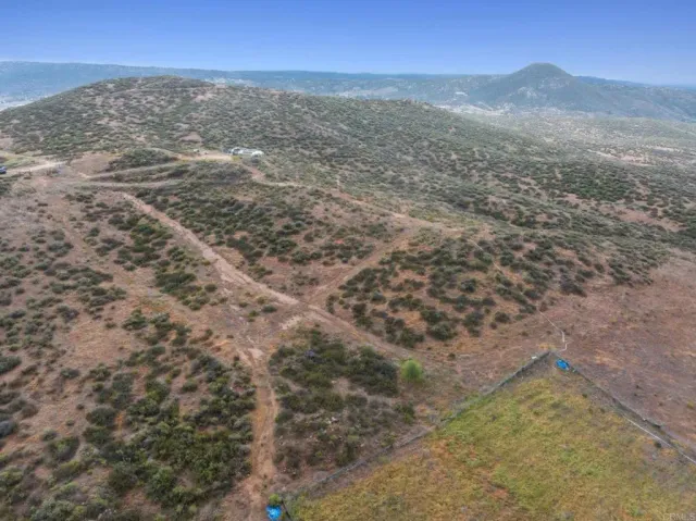 a view of ocean with a mountain