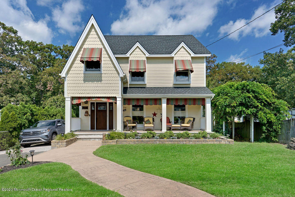 802 Wall Road Spring Lake Heights, NJ 07762 - Photo 1 of 27 a front view of a house with a yard