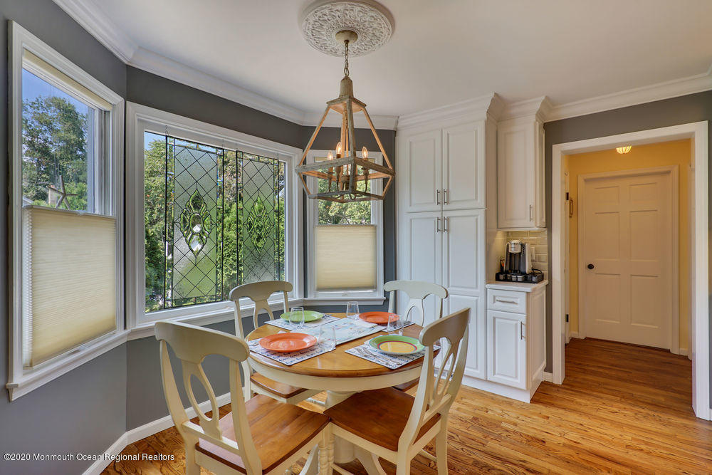 802 Wall Road Spring Lake Heights, NJ 07762 - Photo 12 of 27 a view of a dining room with furniture window and wooden floor
