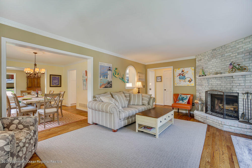 802 Wall Road Spring Lake Heights, NJ 07762 - Photo 14 of 27 a living room with furniture and a fireplace