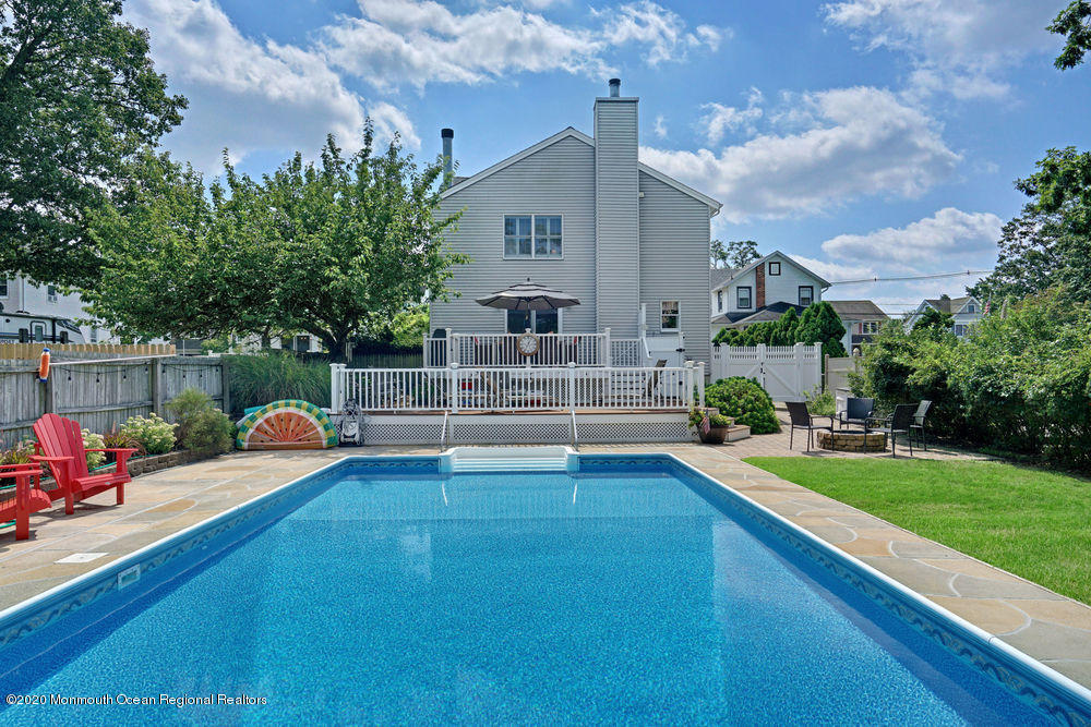 802 Wall Road Spring Lake Heights, NJ 07762 - Photo 23 of 27 a view of house with swimming pool and yard
