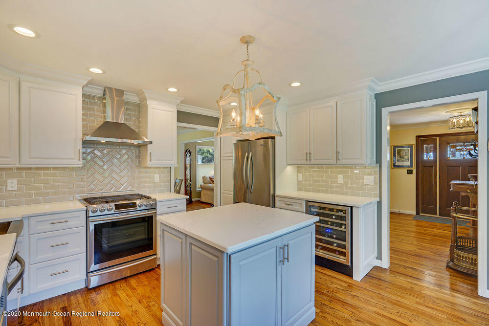802 Wall Road Spring Lake Heights, NJ 07762 - Photo 9 of 27 a kitchen with stainless steel appliances granite countertop a stove and a refrigerator