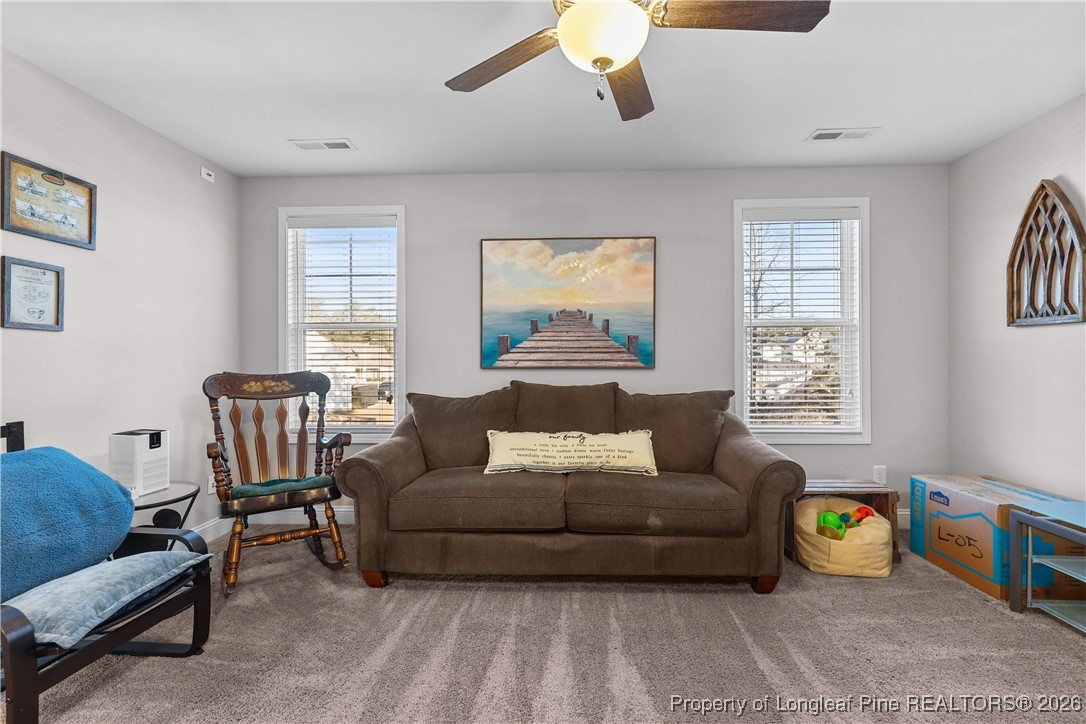 1908 Sweetfern Place Aberdeen, NC 28315 - Photo 16 of 46 a living room with furniture and a window