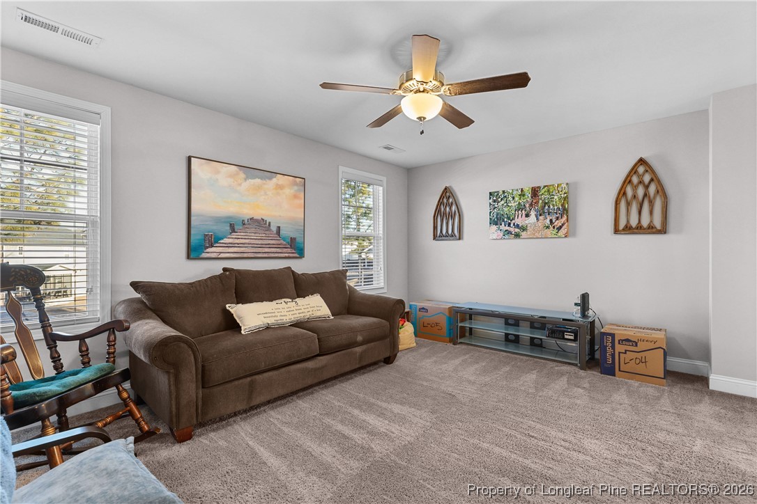 1908 Sweetfern Place Aberdeen, NC 28315 - Photo 18 of 46 a living room with furniture and a window