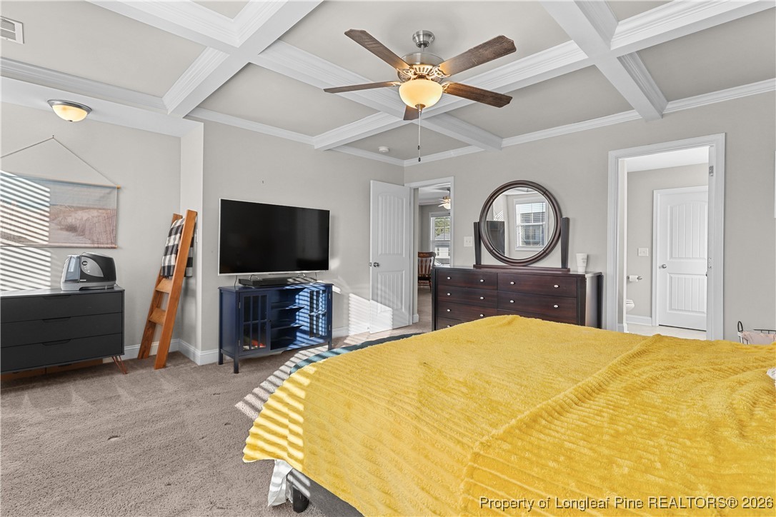 1908 Sweetfern Place Aberdeen, NC 28315 - Photo 20 of 46 a bedroom with a bed a mirror on dresser and a flat screen tv