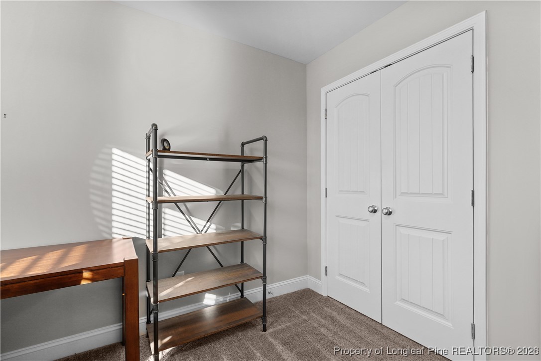 1908 Sweetfern Place Aberdeen, NC 28315 - Photo 28 of 46 a view of a room with racks on the wall