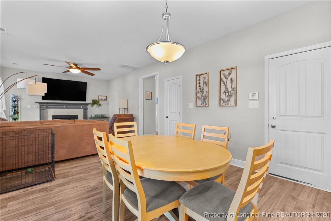 1908 Sweetfern Place Aberdeen, NC 28315 - Photo 9 of 46 a view of a dining room with furniture and wooden floor