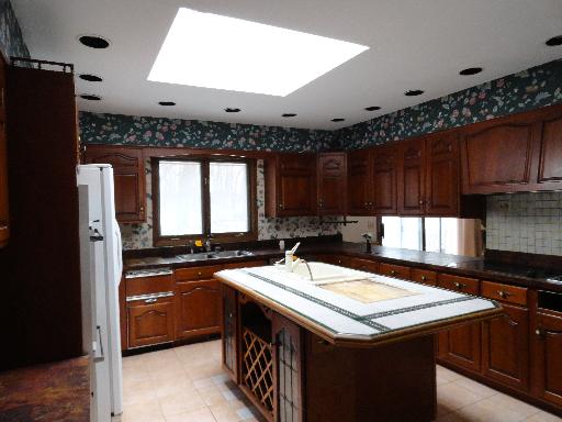 33W662 Hub Road Wayne, IL 60174 - Photo 5 of 16 a kitchen with a sink a stove a refrigerator and cabinets