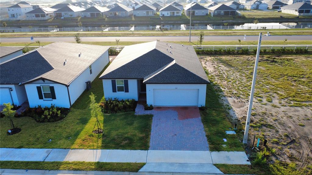 3765 Giorgio Drive Winter Haven, FL 33884 - Photo 1 of 1 a front view of a house with garden