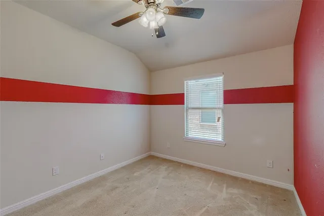 a room with window and ceiling fan