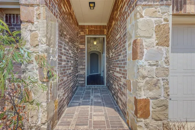 a entryway with brick walls