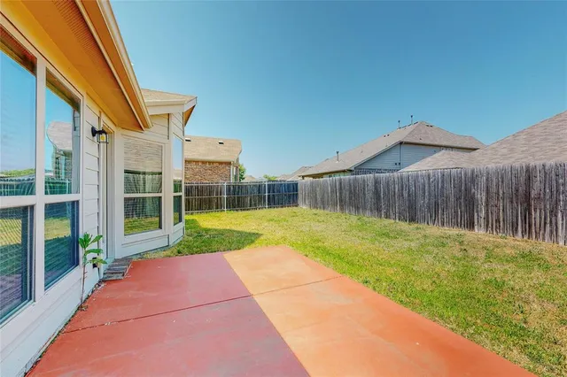 a view of backyard with green space