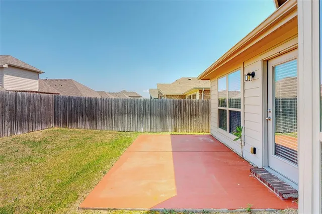 a view of swimming pool with deck in the backyard