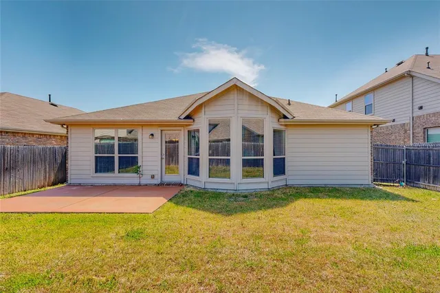 a view of a house with a yard and porch