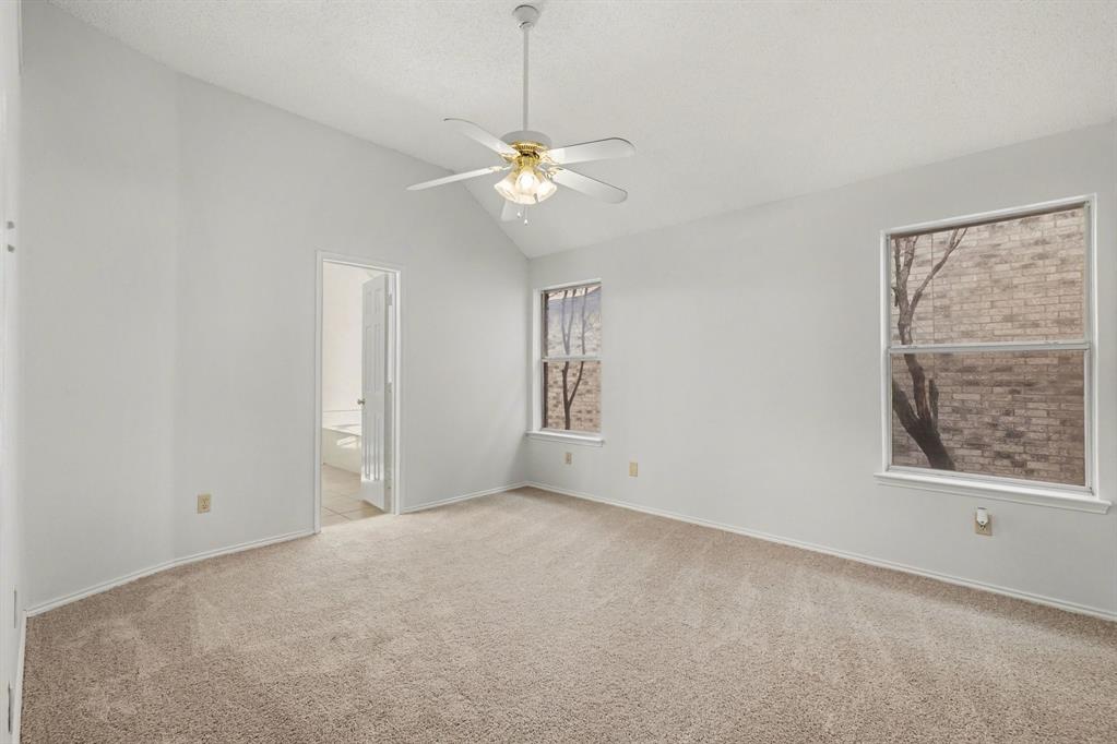 6921 Hominy Ridge Rowlett, TX 75089 - Photo 13 of 27 a view of an empty room with a window