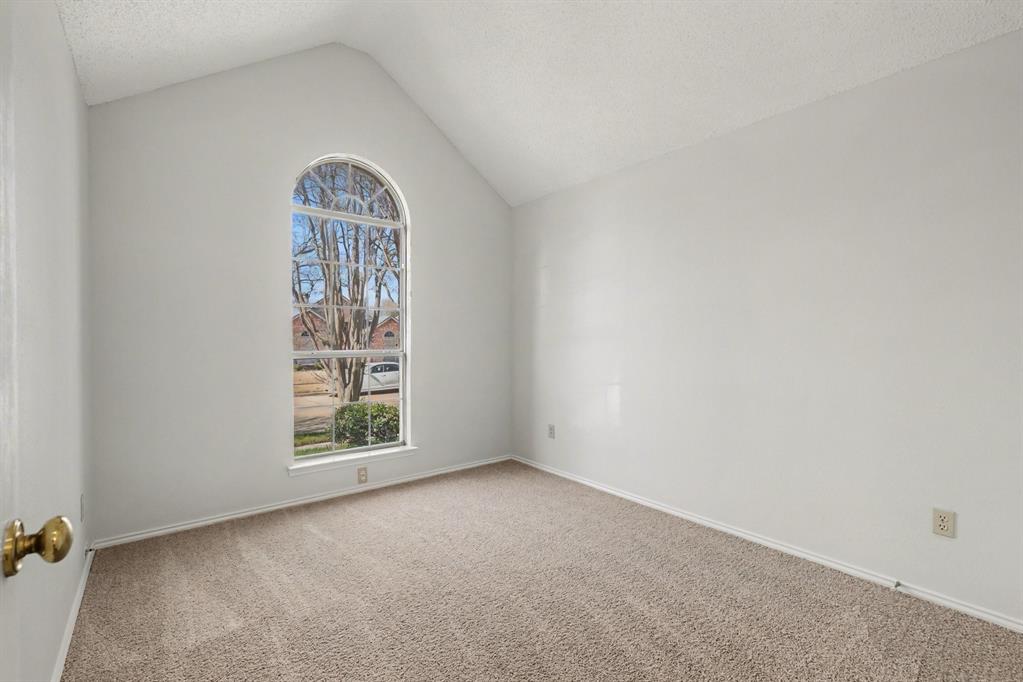 6921 Hominy Ridge Rowlett, TX 75089 - Photo 17 of 27 an empty room with windows