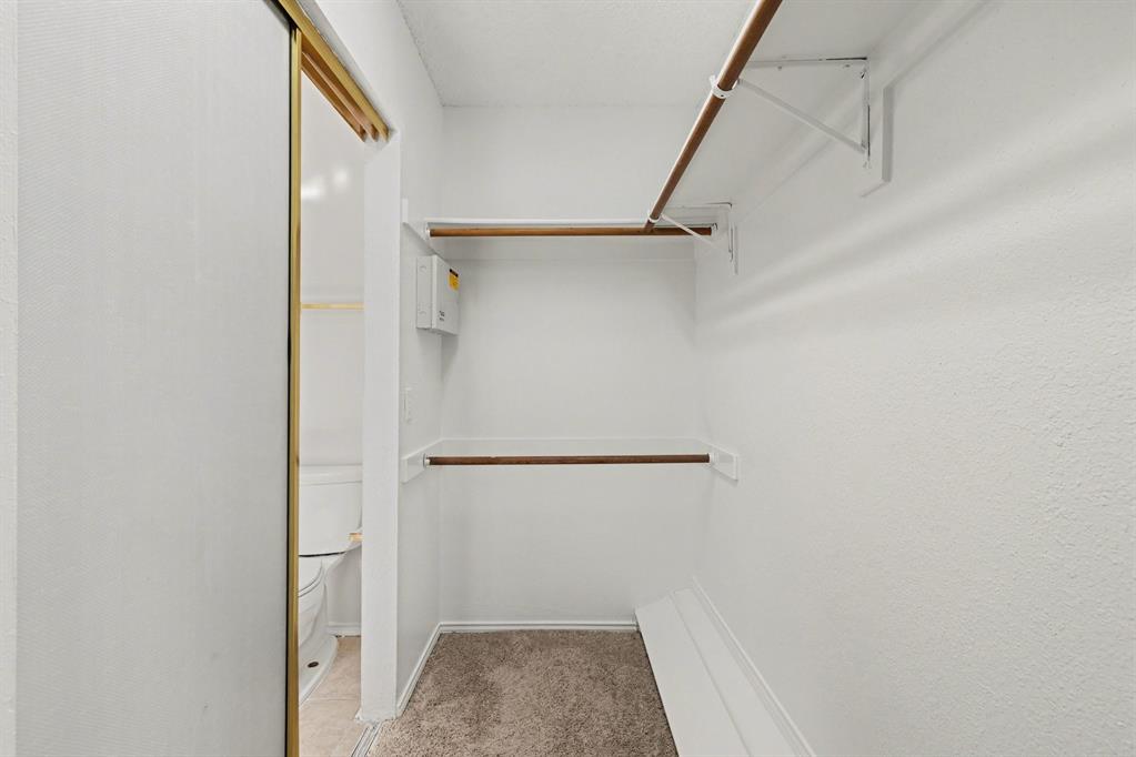 6921 Hominy Ridge Rowlett, TX 75089 - Photo 21 of 27 a view of walk in closet with empty racks