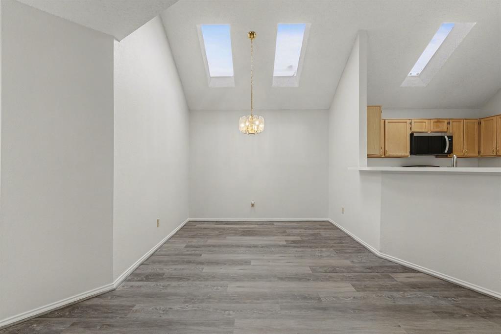 6921 Hominy Ridge Rowlett, TX 75089 - Photo 8 of 27 wooden floor in an empty room