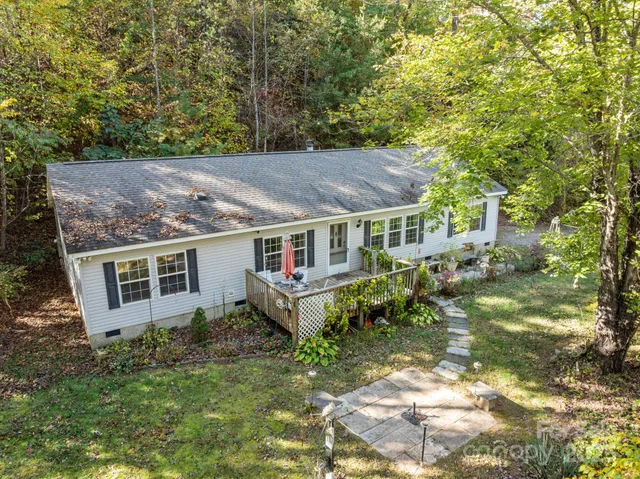 aerial view of a house with a yard