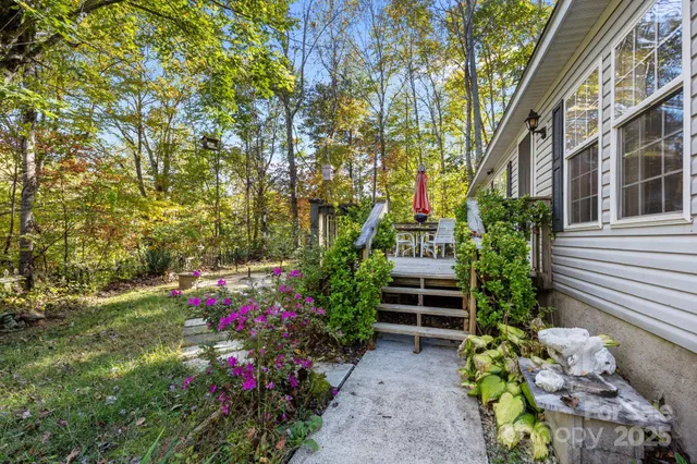 a view of a wooden chairs and table on the wooden deck
