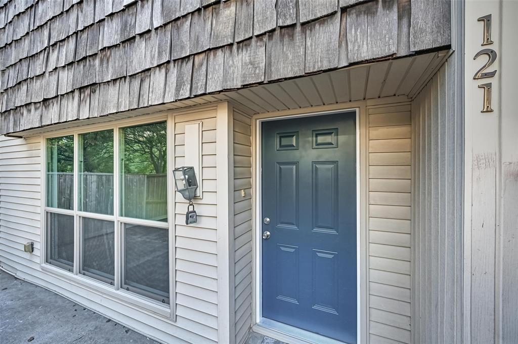 a view of a wooden door of the house