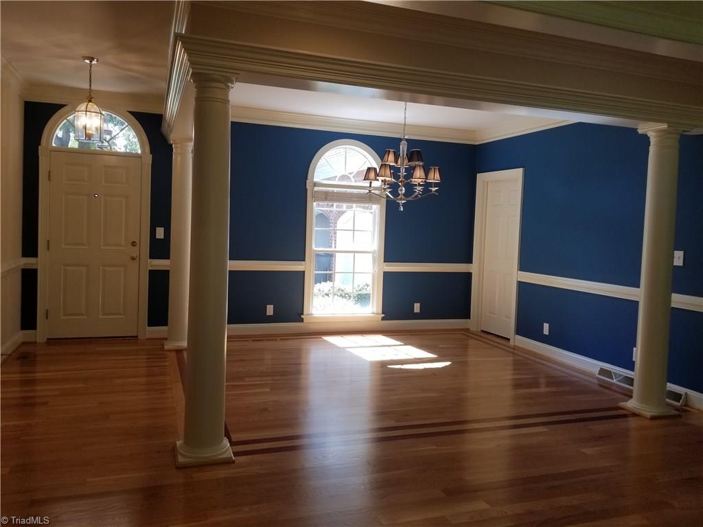 110 Mt Sorrel Road King, NC 27021 - Photo 3 of 30 Arched accents, columns, chandelier, beautiful hardwood floors, dining opens to butler's pantry.