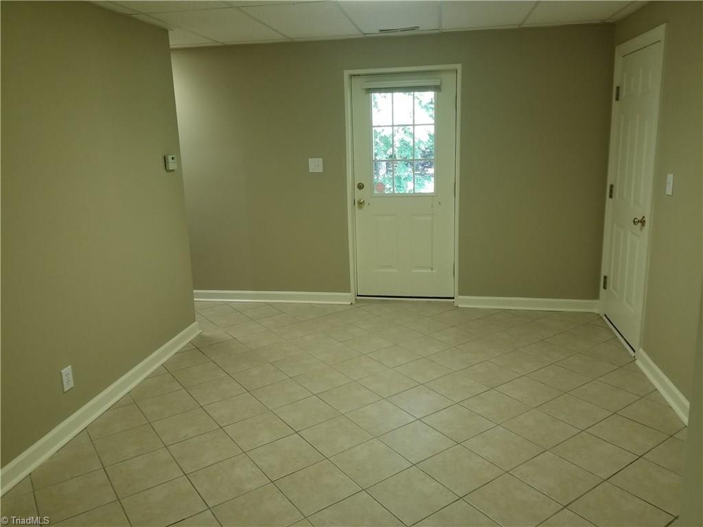 110 Mt Sorrel Road King, NC 27021 - Photo 22 of 30 Tile floors and accessible to lower level patio.
