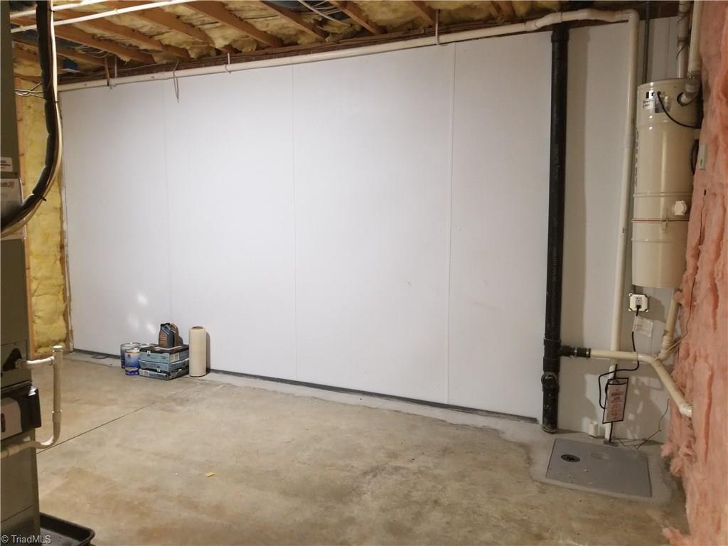 110 Mt Sorrel Road King, NC 27021 - Photo 23 of 30 This huge storage , mechanical room has htpmp, central vac and huge hot water htr, and waterproofing system.