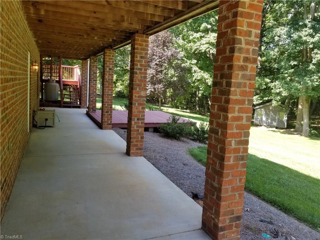 110 Mt Sorrel Road King, NC 27021 - Photo 29 of 30 Huge lower level patio with sun deck extension or hot tub area!