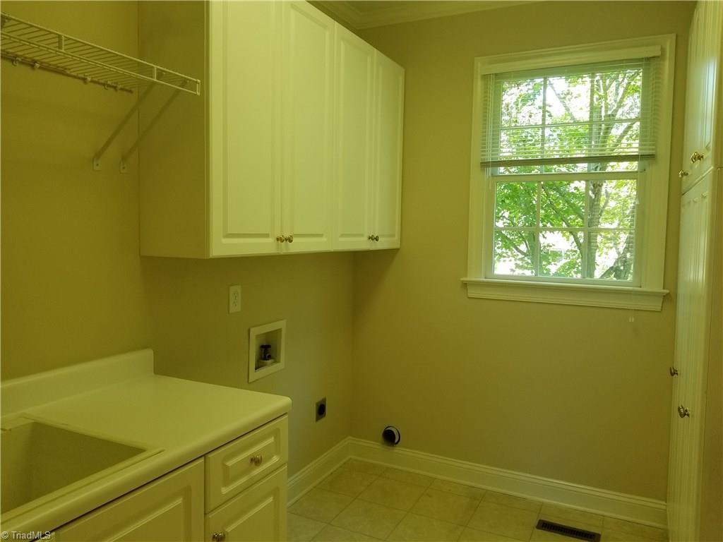 110 Mt Sorrel Road King, NC 27021 - Photo 10 of 30 Laundry room right off kitchen at back door from garage. Easy for unloading groceries etc.