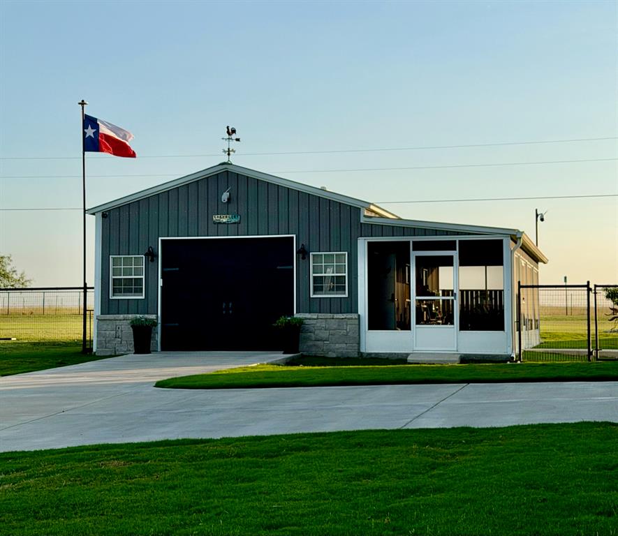 6628 Buffalo Ridge Circle Godley, TX 76044 - Photo 34 of 39 a front view of a house with a yard and garage