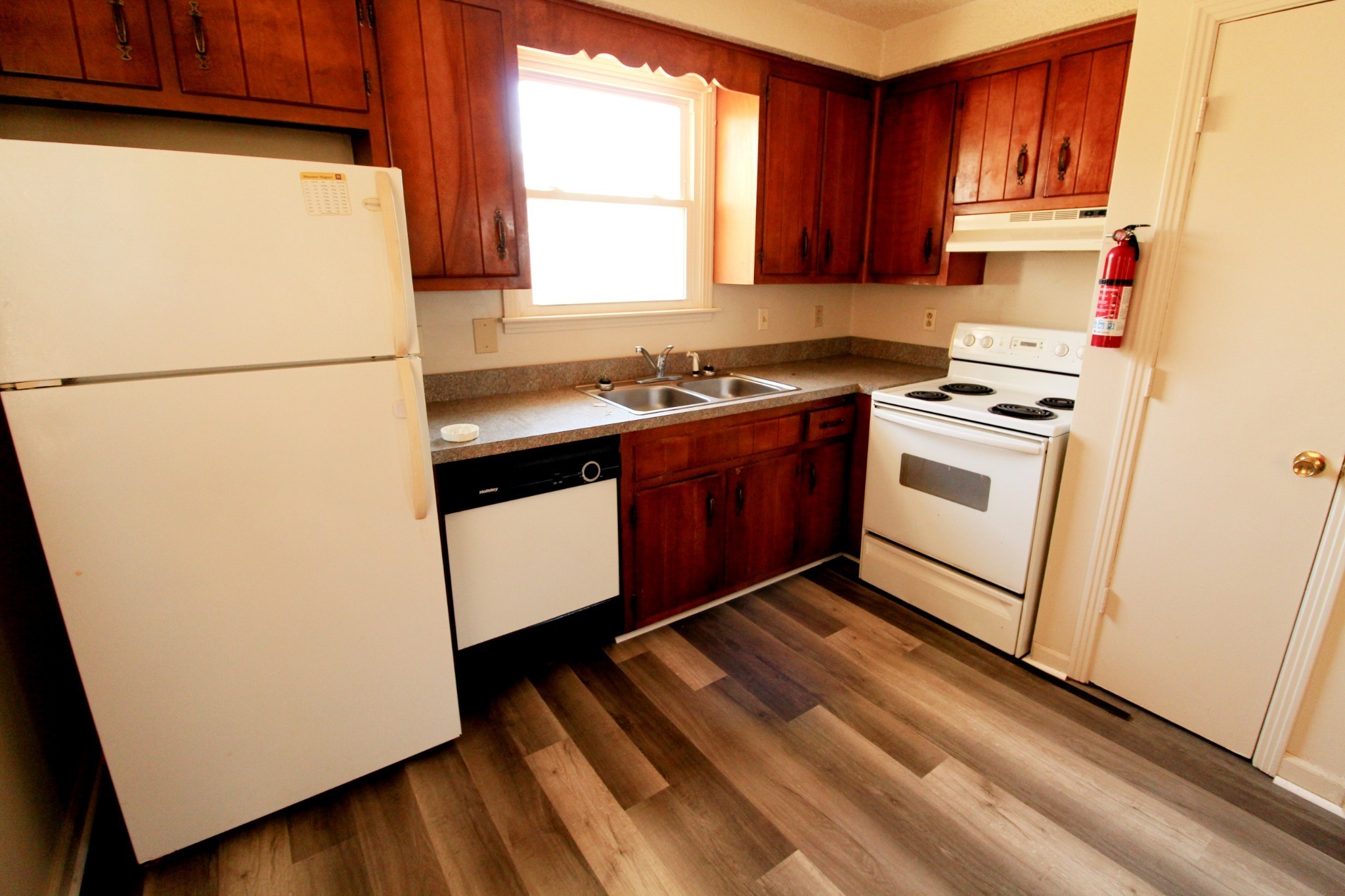 1600 Paradise Hill Road, Unit C Clarksville, TN 37043 - Photo 3 of 6 a kitchen with a refrigerator sink stove and cabinets