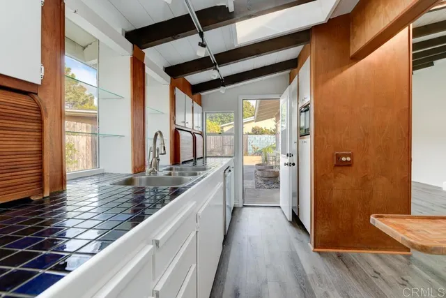 a view of a kitchen from the hallway