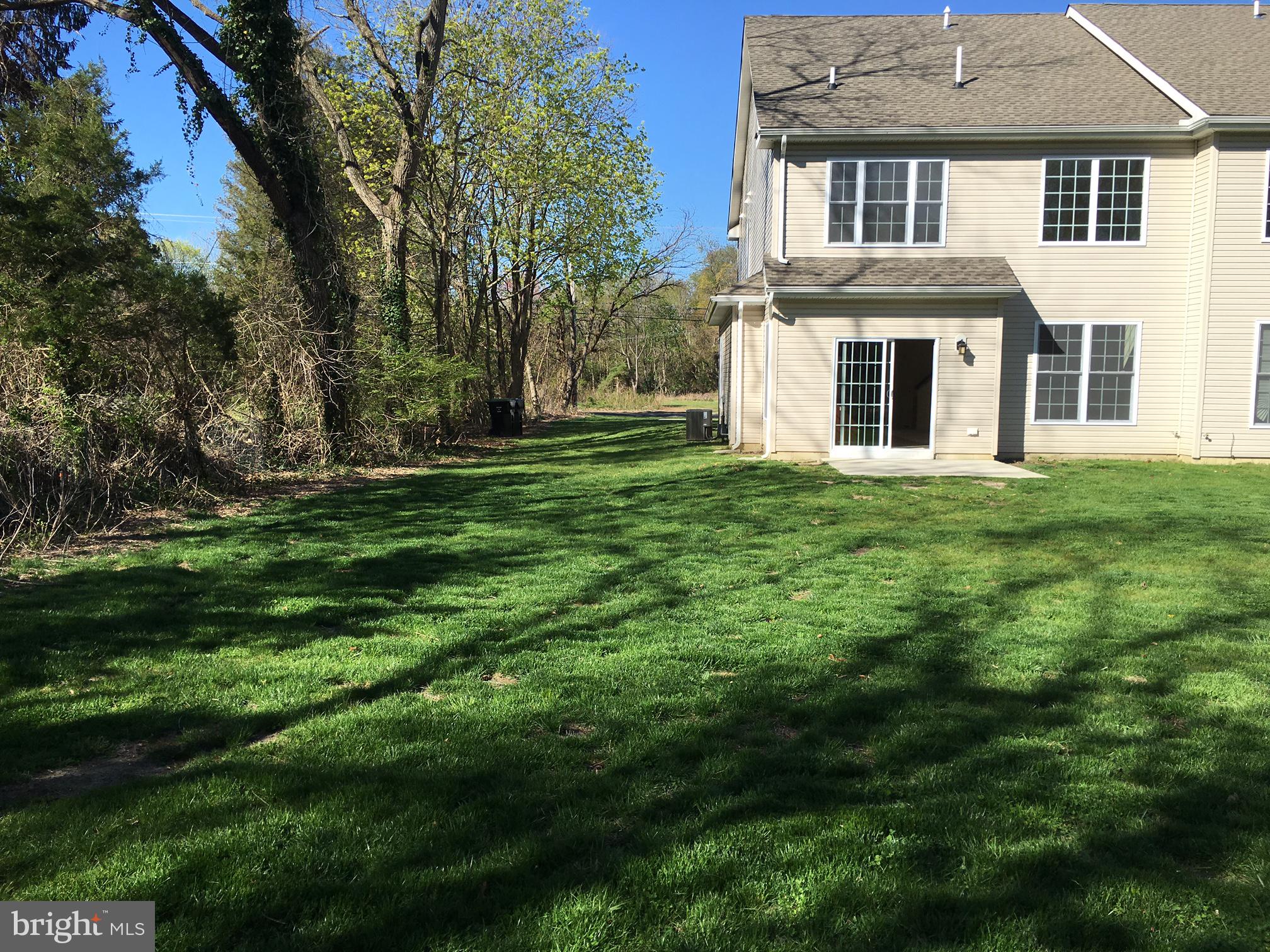 79 Tansboro Road Berlin, NJ 08009 - Photo 4 of 15 Serene backyard with lush greenery.