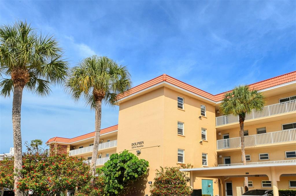 Front picture of Dolphin building beautifully located close to the pool, overlooking the canal and easy walk to beach access right across the street!