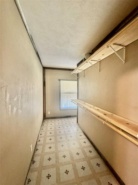 934 Tiffany Street Azle, TX 76020 - Photo 15 of 25 a bathroom with a shower and a toilet