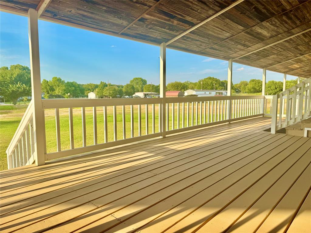 934 Tiffany Street Azle, TX 76020 - Photo 16 of 25 a view of a balcony with wooden floor