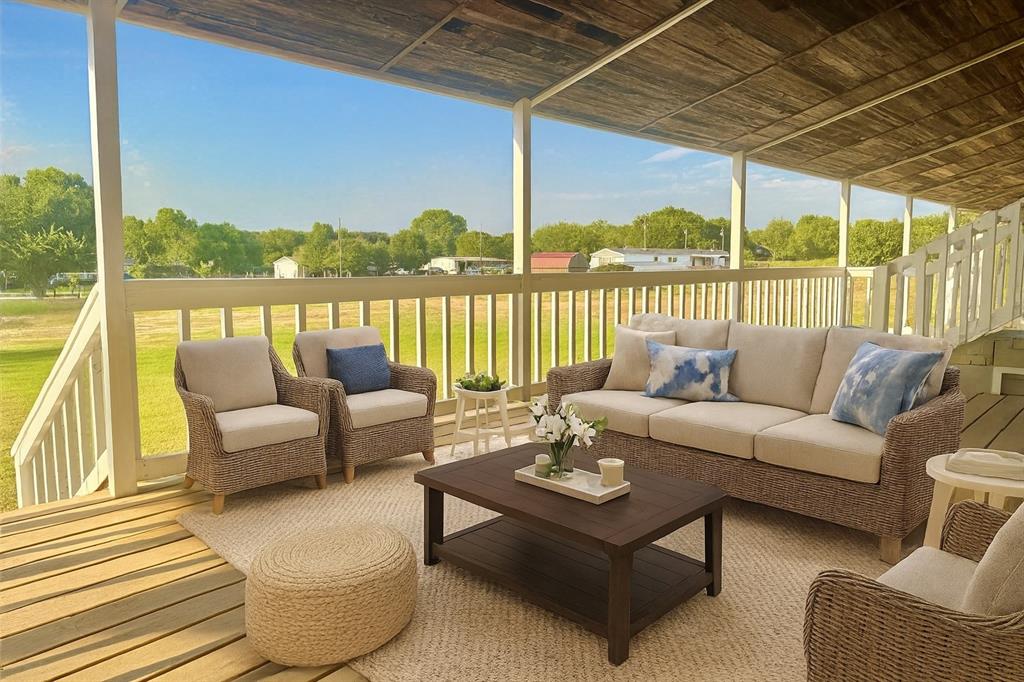 934 Tiffany Street Azle, TX 76020 - Photo 17 of 25 a balcony with furniture and view of lake