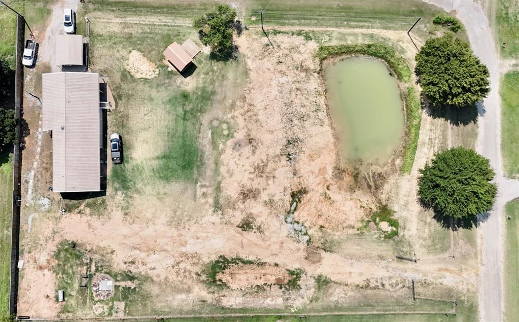 934 Tiffany Street Azle, TX 76020 - Photo 2 of 25 a bathroom with a shower and a mirror