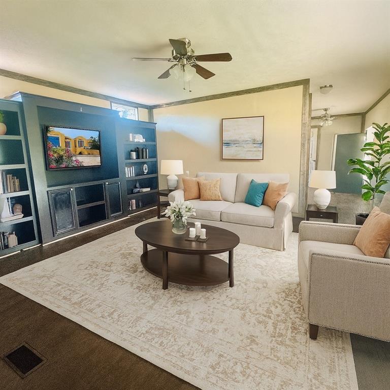 934 Tiffany Street Azle, TX 76020 - Photo 9 of 25 a living room with furniture and a flat screen tv