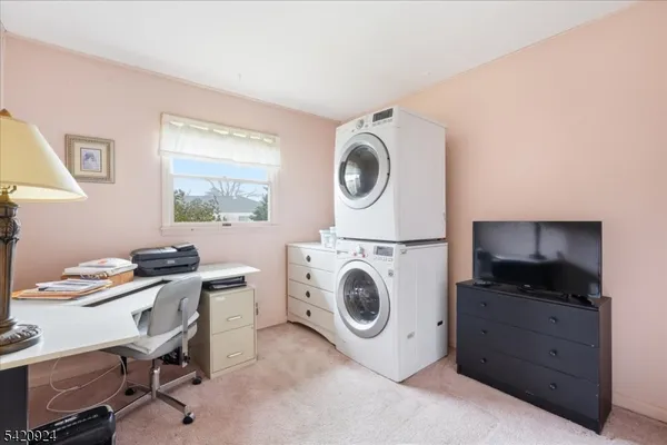 a utility room with sink dryer and washer