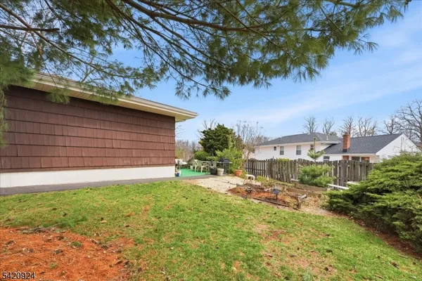 a view of a backyard with a garden