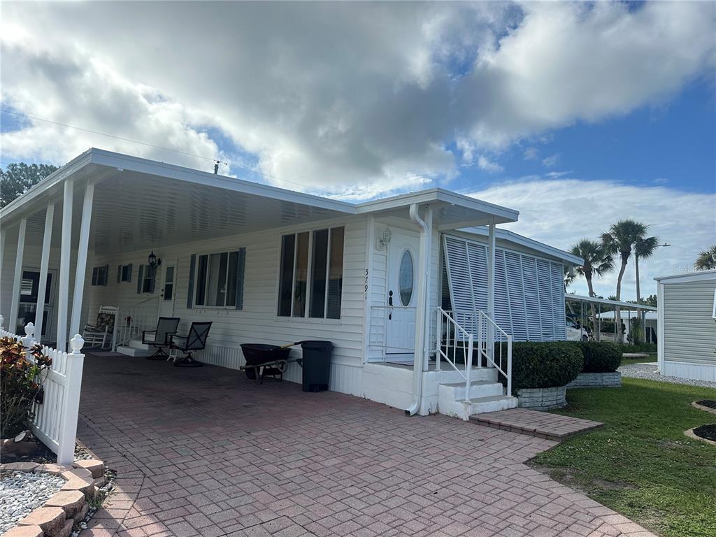 5791 Orange Blossom Road Venice, FL 34293 - Photo 1 of 24 a front view of a house with a patio