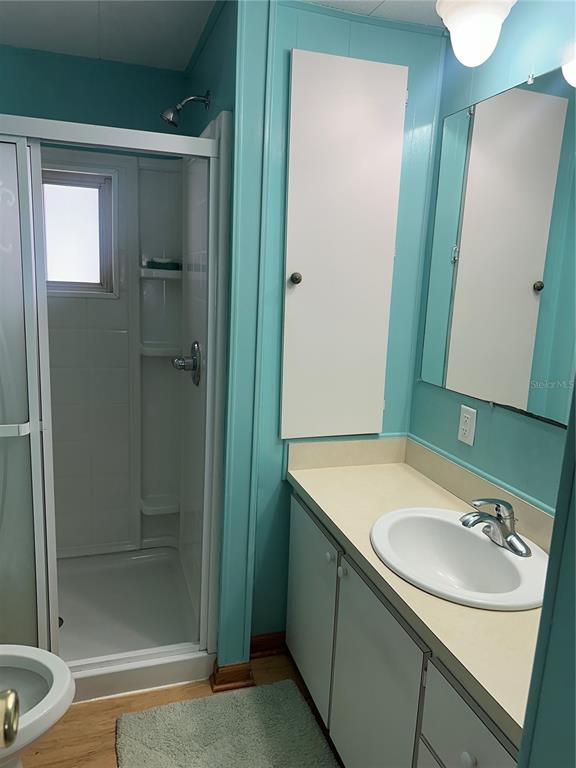 5791 Orange Blossom Road Venice, FL 34293 - Photo 14 of 24 a bathroom with a sink and a mirror