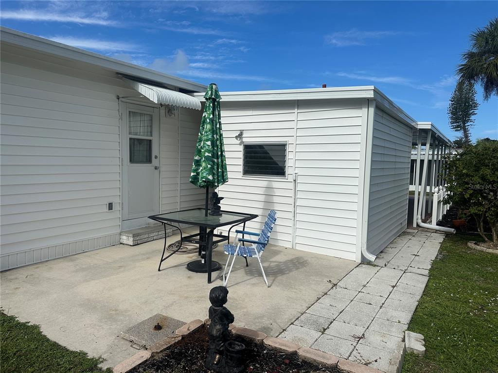 5791 Orange Blossom Road Venice, FL 34293 - Photo 15 of 24 a view of backyard with sitting area