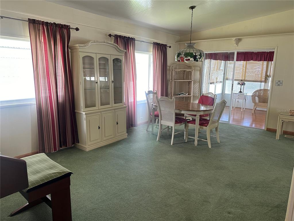 5791 Orange Blossom Road Venice, FL 34293 - Photo 7 of 24 a dining room with furniture and window
