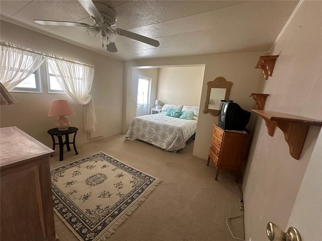 5791 Orange Blossom Road Venice, FL 34293 - Photo 8 of 24 a bedroom with furniture and a window