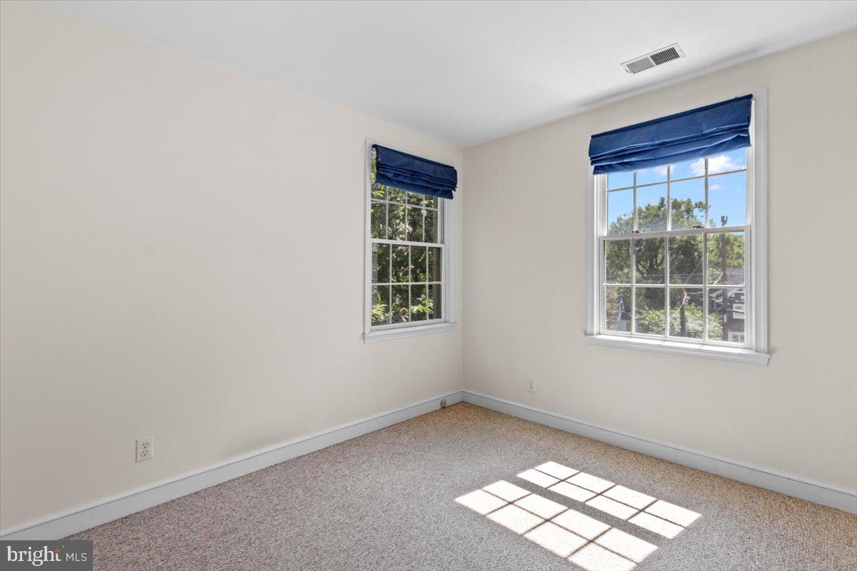 6023 Walhonding Road Bethesda, MD 20816 - Photo 12 of 37 an empty room with windows