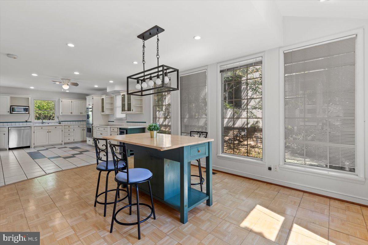 6023 Walhonding Road Bethesda, MD 20816 - Photo 16 of 37 a dining room with furniture and window