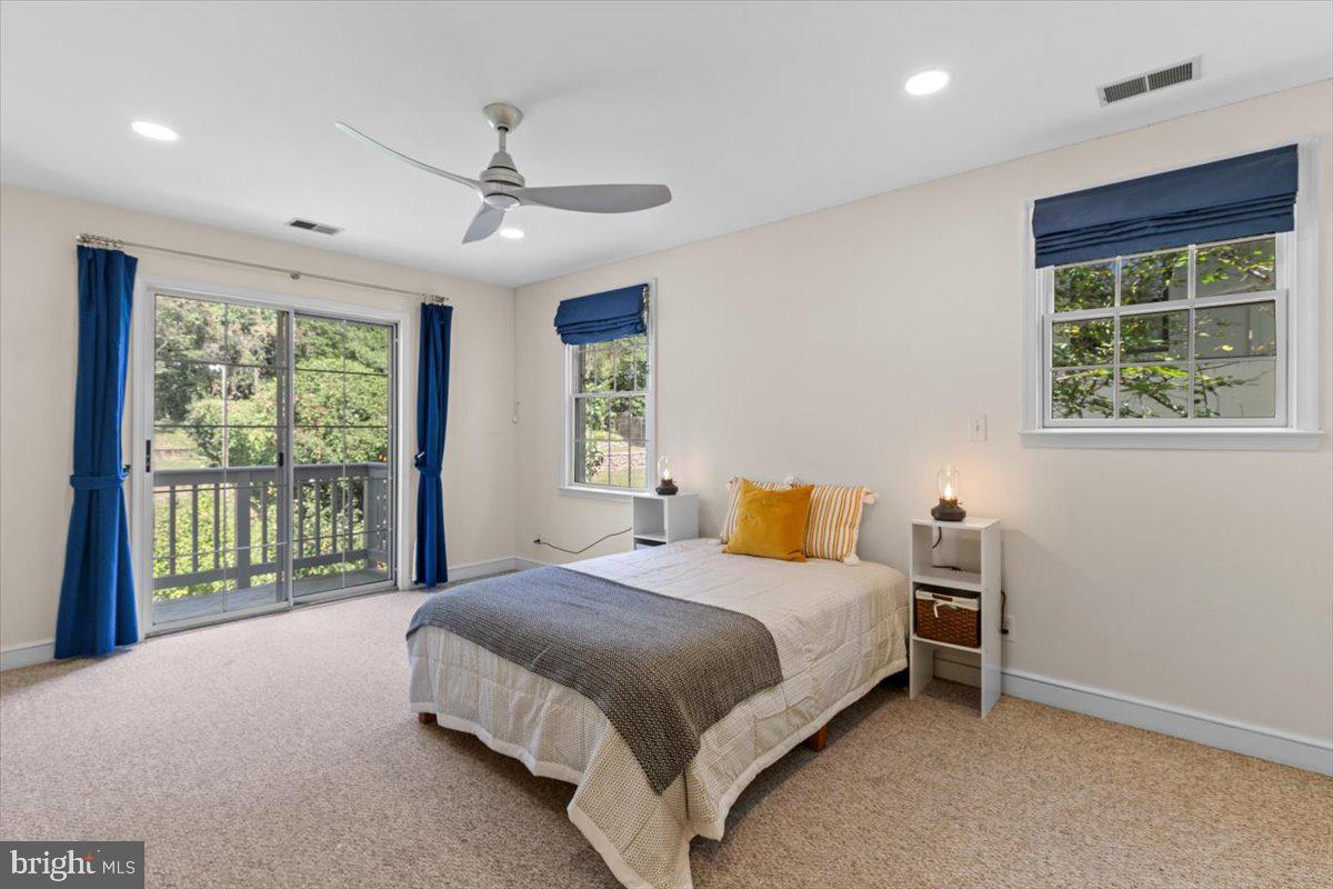 6023 Walhonding Road Bethesda, MD 20816 - Photo 19 of 37 a bedroom with a large bed and a window